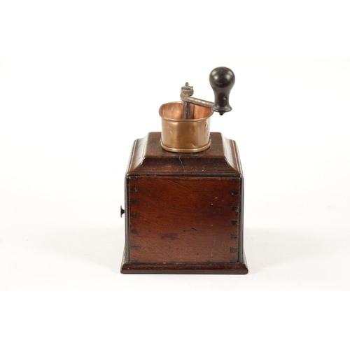 1055 - AN 18TH CENTURY MAHOGANY COFFEE GRINDER with ironwork handle and oval copper pan above a moulded edg... 