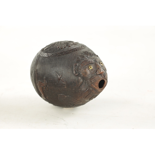 1058 - A FINE 18TH CENTURY CARVED COCONUT POWDER FLASK decorated with a hunting scene, having a flowerhead ... 