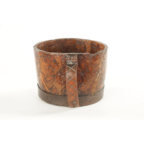 1059 - AN 18TH CENTURY SCANDINAVIAN BURR ELM AND IRON BOUND MUG with cross hatched shaped side handle. (13c... 