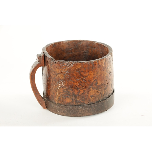 1059 - AN 18TH CENTURY SCANDINAVIAN BURR ELM AND IRON BOUND MUG with cross hatched shaped side handle. (13c... 