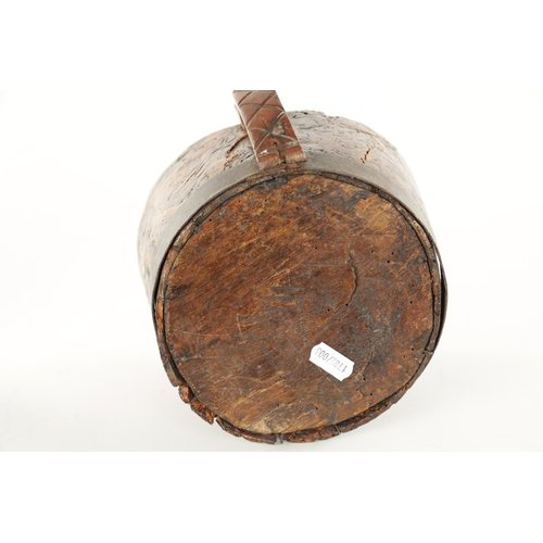 1059 - AN 18TH CENTURY SCANDINAVIAN BURR ELM AND IRON BOUND MUG with cross hatched shaped side handle. (13c... 