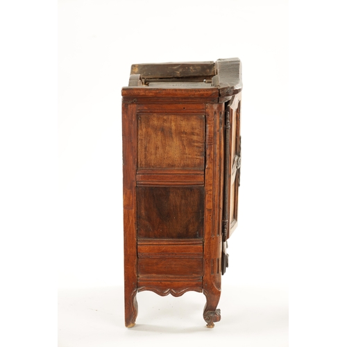 1061 - AN 18TH CENTURY FRUITWOOD MINIATURE ARMOIRE with panelled doors and frieze drawer to the base. (36.5... 