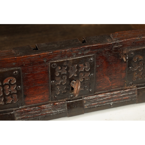 1067 - A RARE LATE 16TH CENTURY NUREMBERG IRON-BOUND OAK TABLE DESK the sloping hinged top with decorative ... 