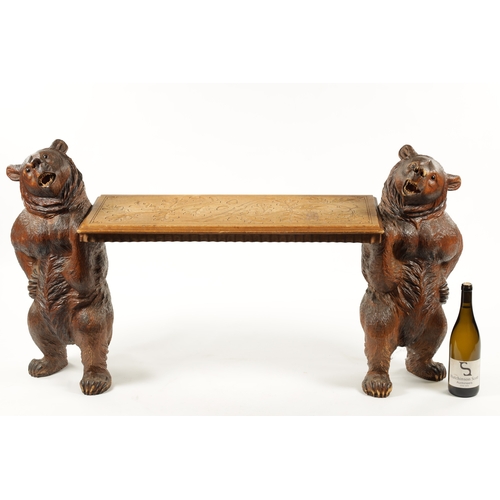 1068 - A GOOD 19TH CENTURY BLACK FOREST LINDEN WOOD CARVED BEAR HALL BENCH having two standing bear support... 