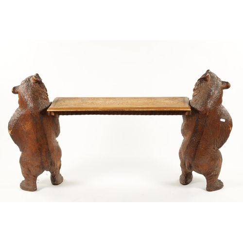 1068 - A GOOD 19TH CENTURY BLACK FOREST LINDEN WOOD CARVED BEAR HALL BENCH having two standing bear support... 