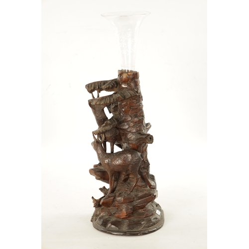 1072 - A LATE 19TH CENTURY CARVED BLACK FOREST EPERGNE CENTREPIECE modelled as two Chamois standing on a ro... 