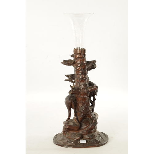 1072 - A LATE 19TH CENTURY CARVED BLACK FOREST EPERGNE CENTREPIECE modelled as two Chamois standing on a ro... 