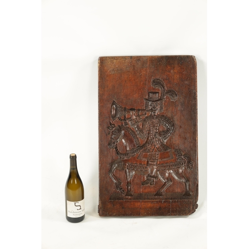 1073 - AN 18TH CENTURY CARVED FRUITWOOD GINGER BREAD MOULD modelled as a horn blower on horse back (68cm hi... 