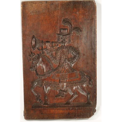 1073 - AN 18TH CENTURY CARVED FRUITWOOD GINGER BREAD MOULD modelled as a horn blower on horse back (68cm hi... 