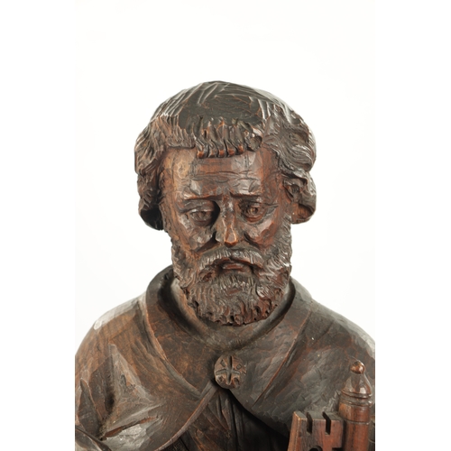 1075 - AN EARLY CARVED FIGURE OF ST. PETER standing holding keys and the bible (103cm high)