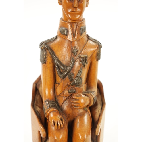 1080 - AN UNUSUAL CARVED BOXWOOD FIGURE OF NAPOLEON in full uniform seated in a chair (21cm high )