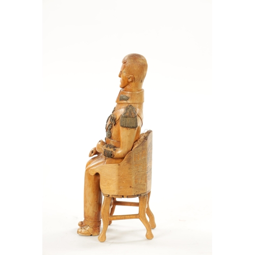 1080 - AN UNUSUAL CARVED BOXWOOD FIGURE OF NAPOLEON in full uniform seated in a chair (21cm high )