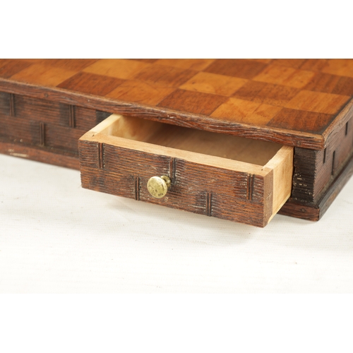 1082 - A 19TH CENTURY CARVED WOOD DOUBLE SIDED CHESS BOARD with pull-out drawer to each side, mixed wood in... 