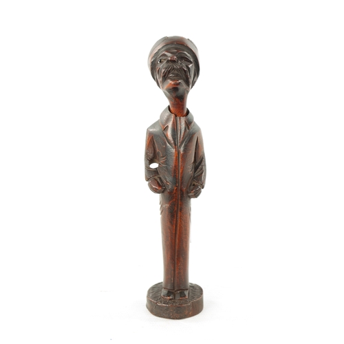 1086 - A 19TH CENTURY CONTINENTAL CARVED FRUITWOOD FIGURAL PIPE AND STAND with inset glass eye (one missing... 