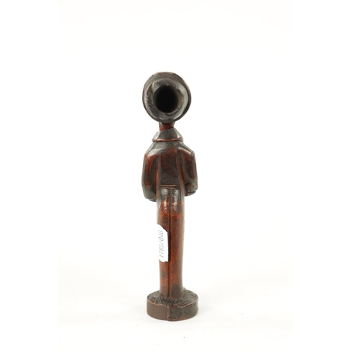 1086 - A 19TH CENTURY CONTINENTAL CARVED FRUITWOOD FIGURAL PIPE AND STAND with inset glass eye (one missing... 