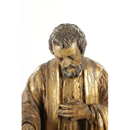 1087 - AN EARLY 17TH CENTURY CARVED WOOD GILT GESSO FIGURE OF CHRIST (104cm high)