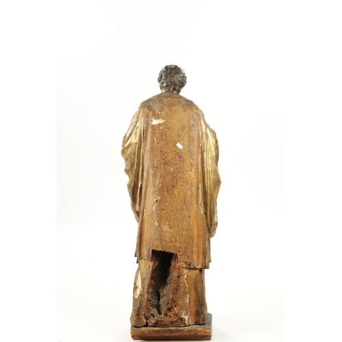 1087 - AN EARLY 17TH CENTURY CARVED WOOD GILT GESSO FIGURE OF CHRIST (104cm high)