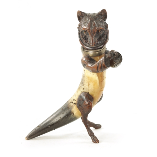 1096 - A 19TH CENTURY BLACK FORREST CARVED WOOD AND HORN INKWELL formed as a standing hooded fox with hinge... 