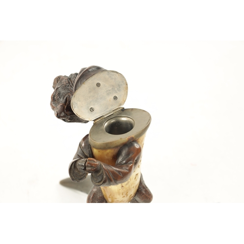 1096 - A 19TH CENTURY BLACK FORREST CARVED WOOD AND HORN INKWELL formed as a standing hooded fox with hinge... 