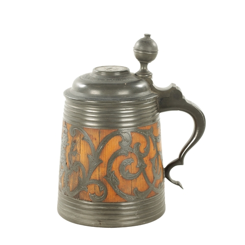 1101 - A 19TH CENTURY SWEDISH COMMEMORATIVE OAK AND PEWTER TANKARD inlaid scrollwork decoration and royal c... 