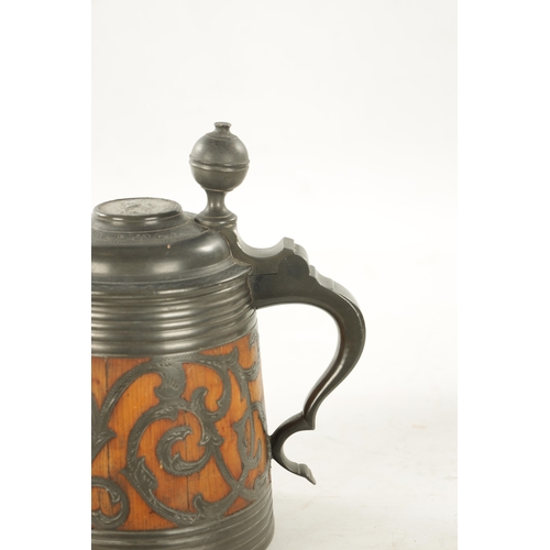 1101 - A 19TH CENTURY SWEDISH COMMEMORATIVE OAK AND PEWTER TANKARD inlaid scrollwork decoration and royal c... 