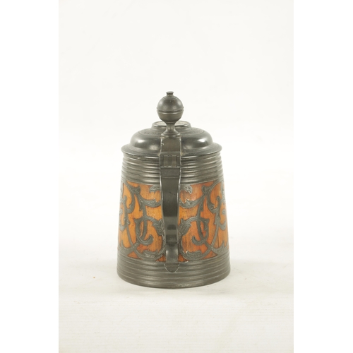 1101 - A 19TH CENTURY SWEDISH COMMEMORATIVE OAK AND PEWTER TANKARD inlaid scrollwork decoration and royal c... 