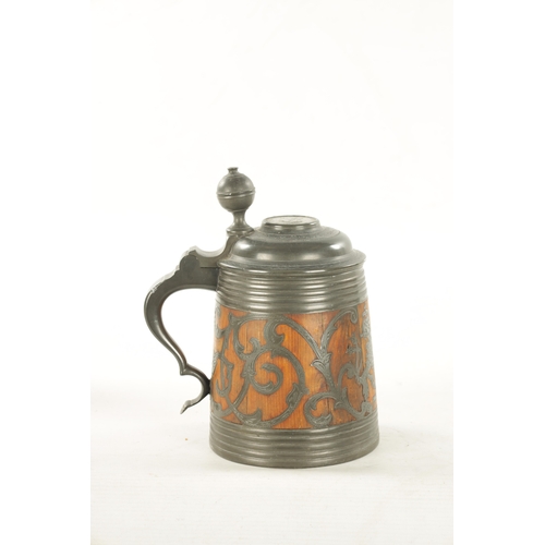 1101 - A 19TH CENTURY SWEDISH COMMEMORATIVE OAK AND PEWTER TANKARD inlaid scrollwork decoration and royal c... 