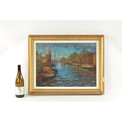 1128 - JOHN MACKIE (SCOTTISH b.1953) A PASTEL ON PAPER of a canal scene, mounted in a moulded gilt glazed f... 