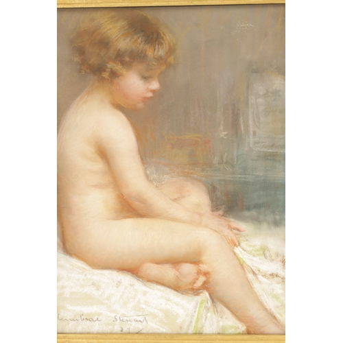 1150 - JANET CUMBRAE STEWART (AUSTRALIAN, 1883 - 1960) PASTEL ON PAPER depicting a nude child - in glazed g... 