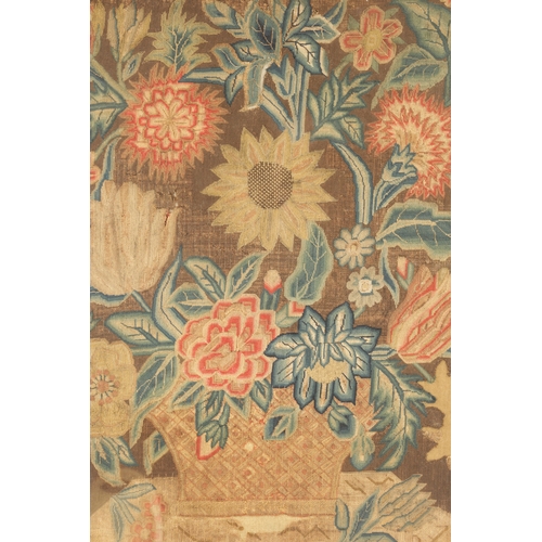 1155 - AN 18TH CENTURY FRAMED NEEDLEWORK PICTURE depicting a colourful flower basket on a shelf. Moulded wa... 