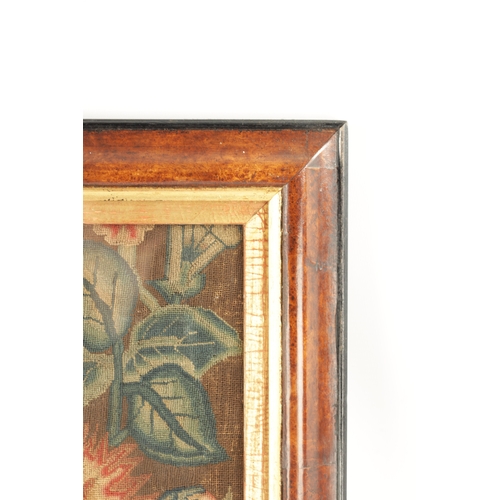 1155 - AN 18TH CENTURY FRAMED NEEDLEWORK PICTURE depicting a colourful flower basket on a shelf. Moulded wa... 