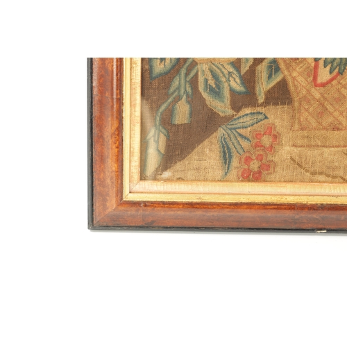 1155 - AN 18TH CENTURY FRAMED NEEDLEWORK PICTURE depicting a colourful flower basket on a shelf. Moulded wa... 