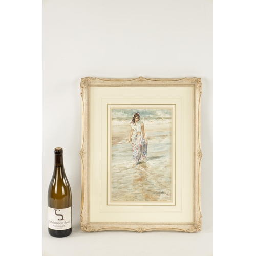 1192 - GORDON KING (b. 1939) WATERCOLOUR. Girl wading in the sea signed lower right - mounted in a glazed l... 