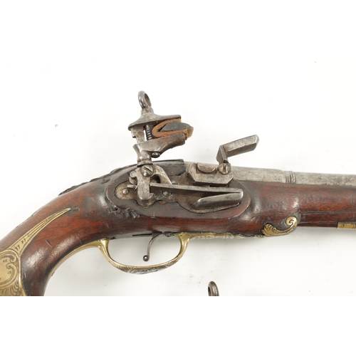 798 - A PAIR OF 18TH CENTURY BRASS MOUNTED SPANISH FLINTLOCK PISTOLS each fitted a two-stage steel barrel ... 