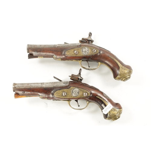 798 - A PAIR OF 18TH CENTURY BRASS MOUNTED SPANISH FLINTLOCK PISTOLS each fitted a two-stage steel barrel ... 