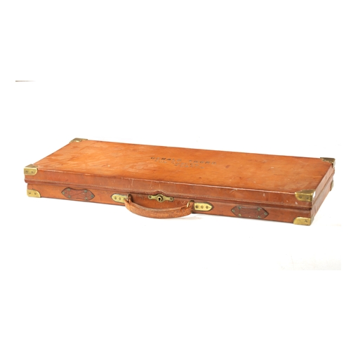 808 - A LATE 19TH CENTURY BRASS BOUND LEATHER SHOTGUN CASE BY BOSS AND C0. with outer canvas case, made fo... 