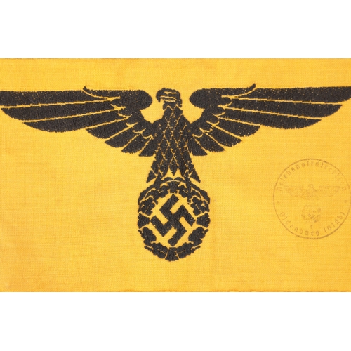 817 - A COLLECTION OF GERMAN WWII THIRD REICH ITEMS comprising of two arm bands and two enamel badges. (4)