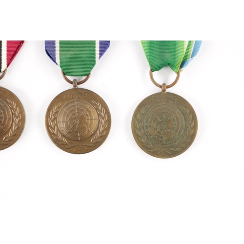 846 - A COLLECTION OF NINE UN SERVICE OF PEACE MEDALS from various countries (9)