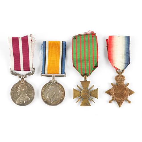 851 - A GROUP OF FOUR WW1 MEDALS comprising of a Long Service Medal awarded to 56199. S.SJT J. SIMPSON. R.... 