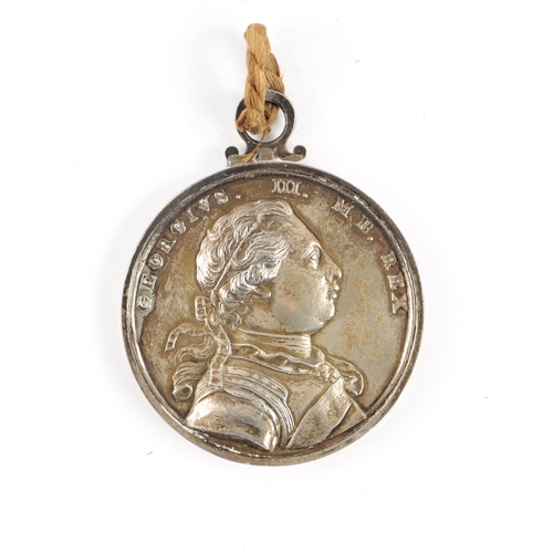 855 - A LARGE GEORGE III SILVER CARIB WAR MEDAL 1773 with chased bust of George III, the reverse showing B... 