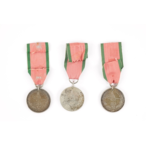 857 - A COLLECTION OF THREE TURKISH CRIMEA MEDALS two inscribed 'LA CRIMEA 1855' and one 'CRIMEA 1855' (3)... 