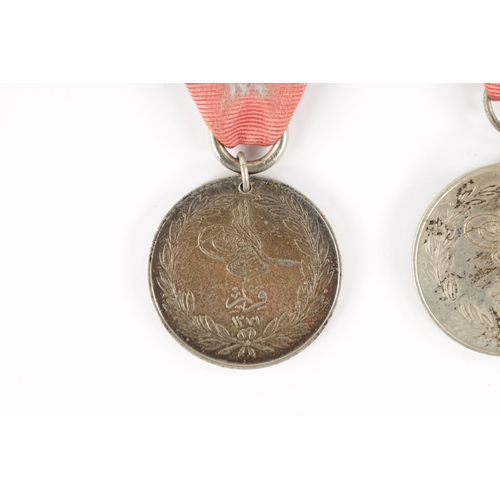 857 - A COLLECTION OF THREE TURKISH CRIMEA MEDALS two inscribed 'LA CRIMEA 1855' and one 'CRIMEA 1855' (3)... 