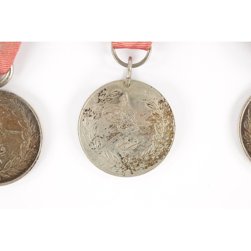 857 - A COLLECTION OF THREE TURKISH CRIMEA MEDALS two inscribed 'LA CRIMEA 1855' and one 'CRIMEA 1855' (3)... 