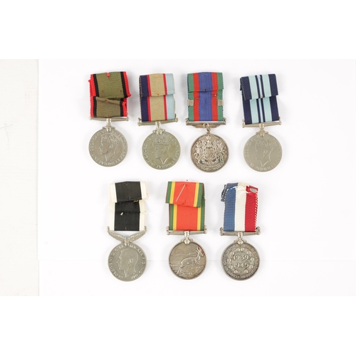 871 - A COLLECTION OF SEVEN WW2 SERVICE MEDALS for New Zealand, unnamed, South Africa, unnamed, India, unn... 