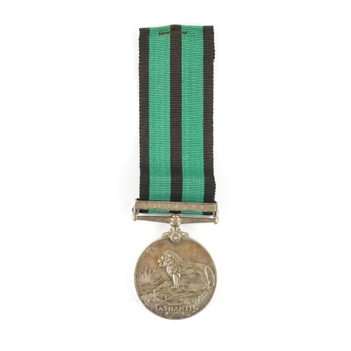 886 - AN ASHANTI MEDAL 1900 WITH CLASP presented to 390 PTE. JOHNNIE DAVIES. W. AFRICAN REGT. Clasp for 'K... 