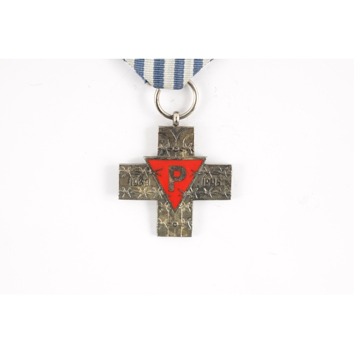 895 - A WW2 POLISH SILVER AUSCHWITZ CROSS PRISONERS MEDAL with red enamel centre