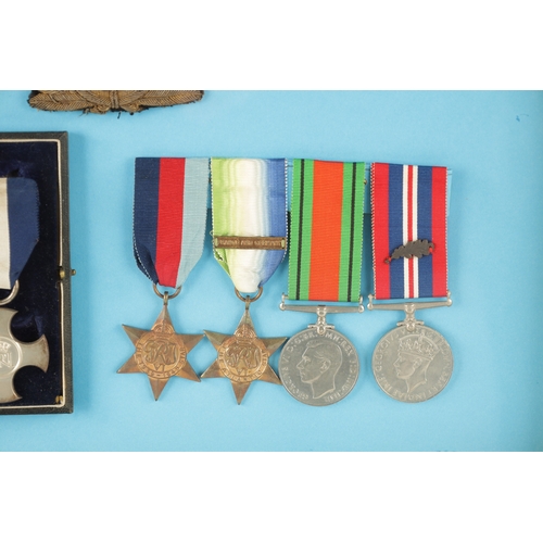 907 - A GROUP OF FIVE WW2 MEDALS in glazed case. Comprising of a Distinguished Service Cross in its origin... 