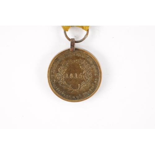 910 - A BRUNSWICK WATERLOO MEDAL 1815 presented to HEINR. LUEDDECKE. TRAINE, with suspension loop and yell... 