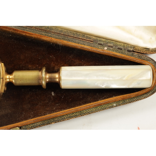 916 - A LATE 19TH CENTURY CASED MAGNIFYING GLASS with a tooled Moroccan leather case, the glass with brass... 