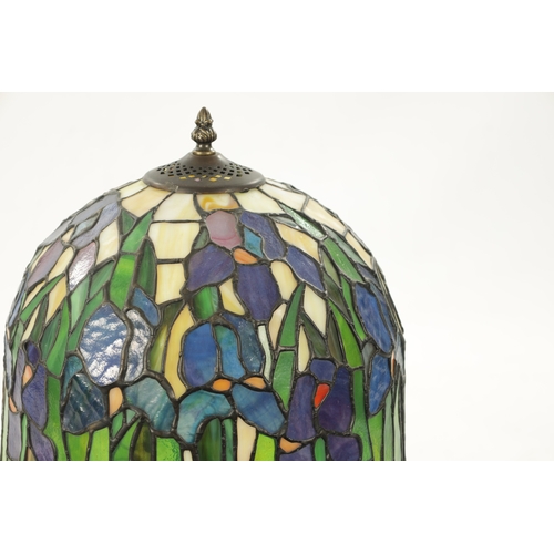 924 - A 20TH CENTURY TIFFANY STYLE BRONZE LAMP with stained glass shade and art nouveau style patinated ba... 